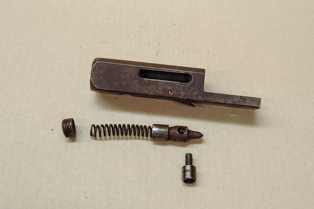 Quackenbush action parts are few. (The trigger is not shown.) Removing the mainspring and firing pin from the breechblock shows that the spring is rather short and can’t compress much.